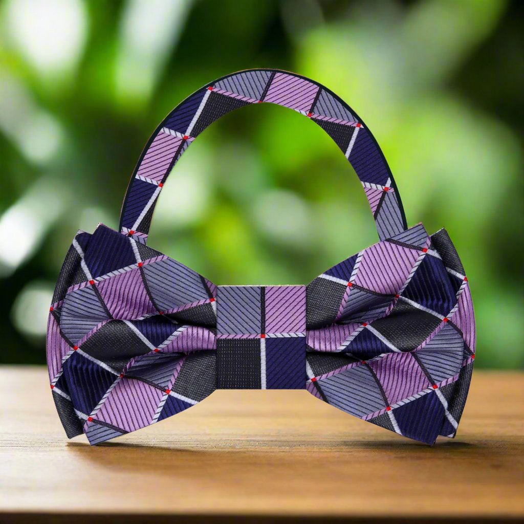 Man wearing a geometric silk bow tie with a matching pocket square, stylish and modern
