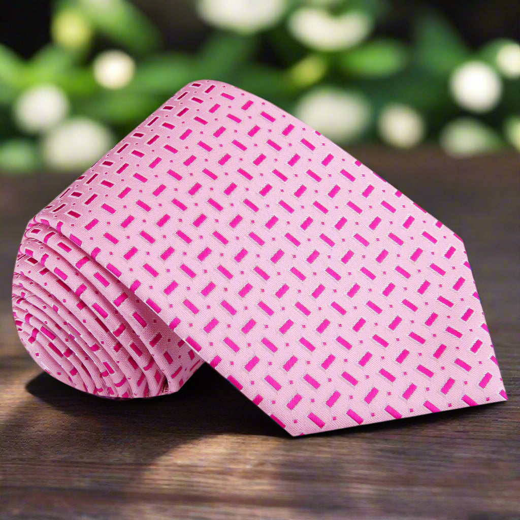 Elegant light pink silk necktie with geometric design, perfect for business meetings.