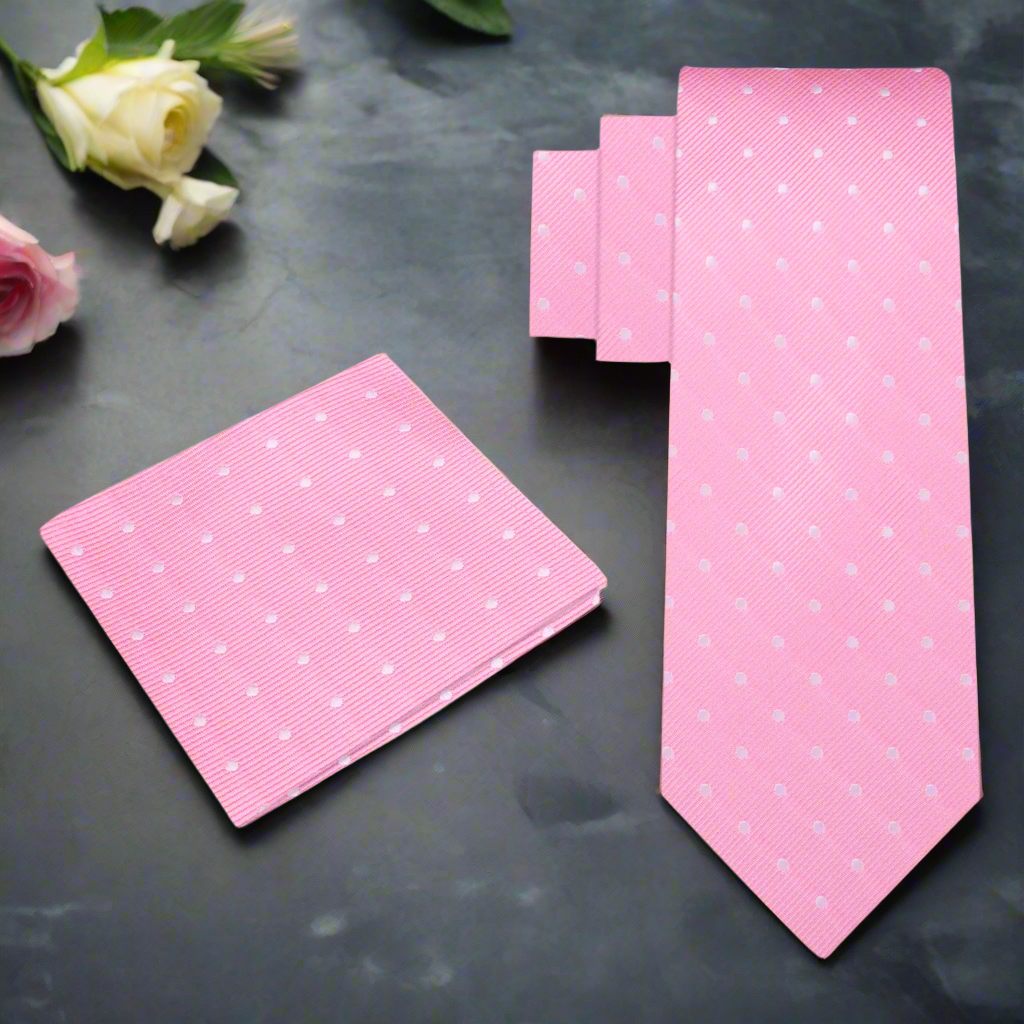 Close-up of blush pink silk tie with white dots, ideal for weddings or spring events