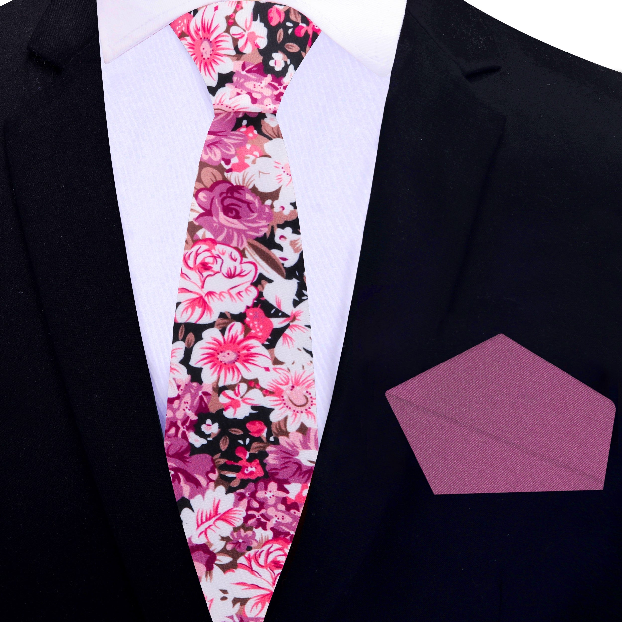 Stylish floral bow tie displayed with a tan suit, ideal for outdoor events.