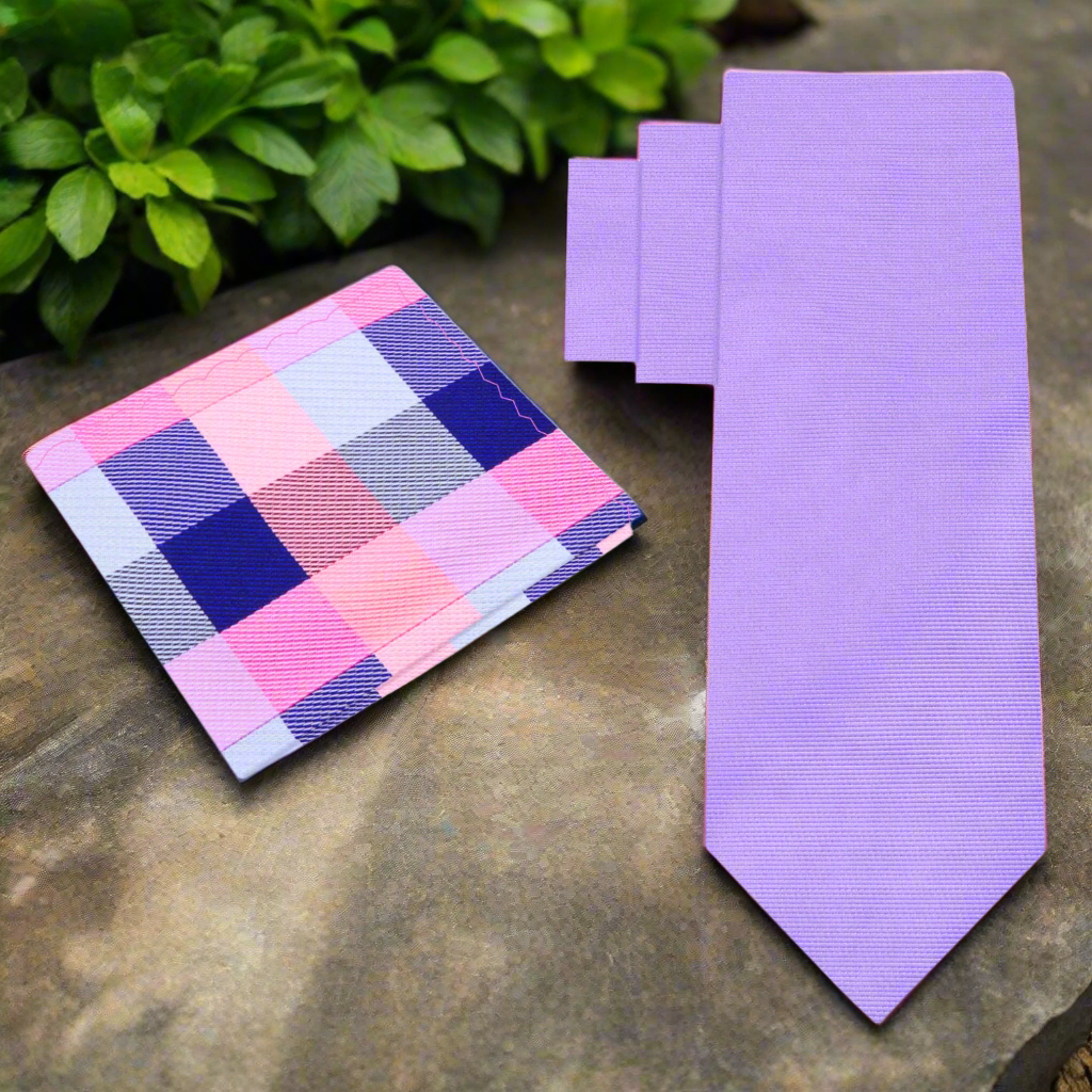 Elegant solid purple silk necktie displayed against a white background, showcasing its luxurious texture.