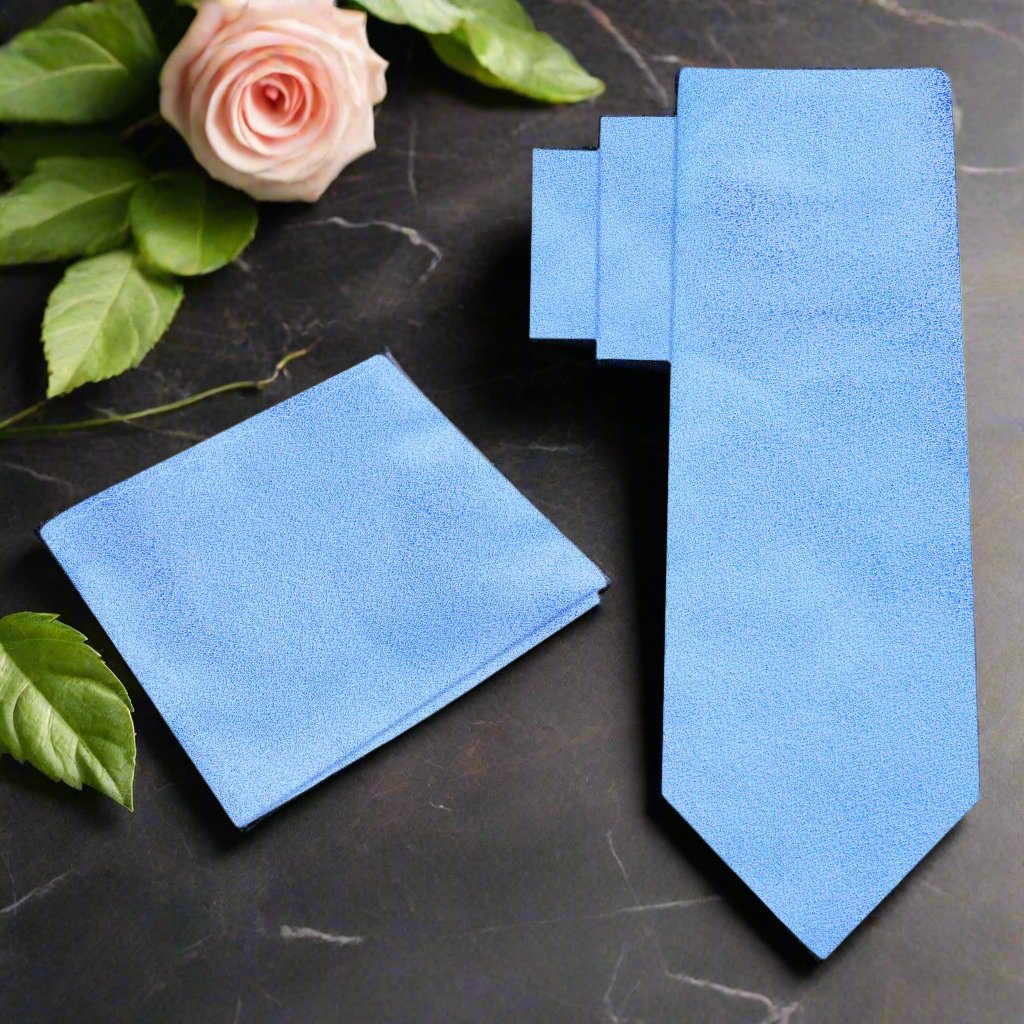 Light blue silk tie with shimmering texture displayed on a mannequin for wedding attire