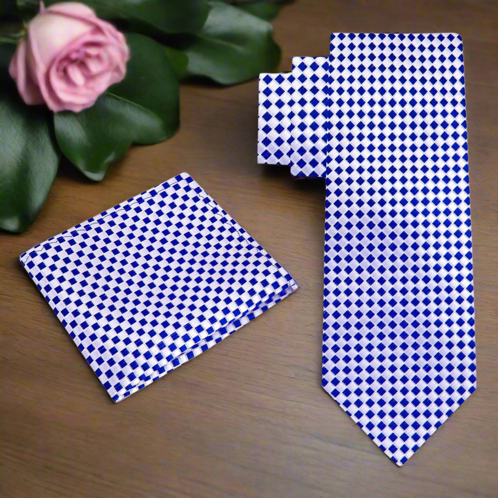 Close-up of silk tie fabric showing diamond pattern in blue and silver