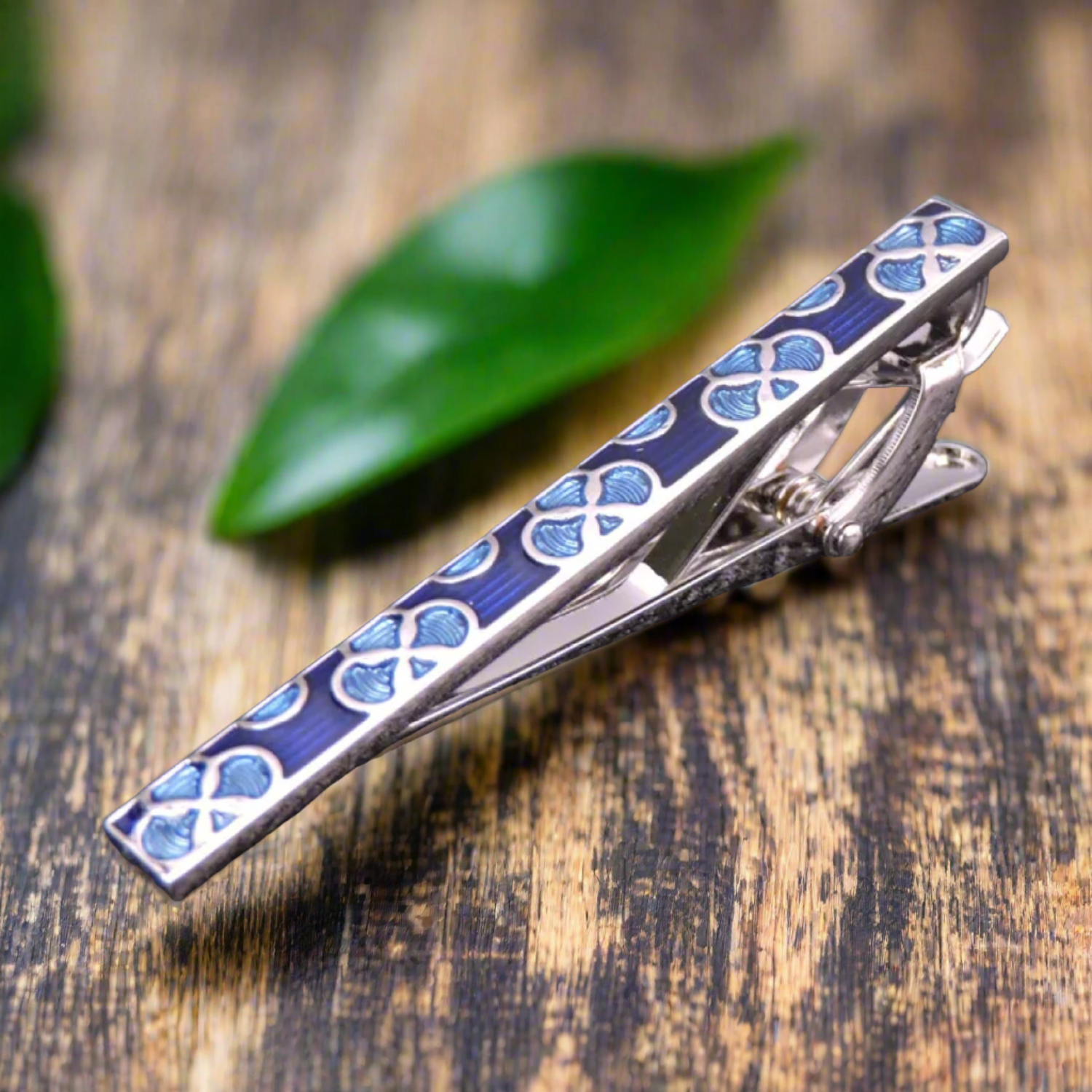 Gold checkerboard tie bar, adding a touch of modern elegance to mens dress accessories.