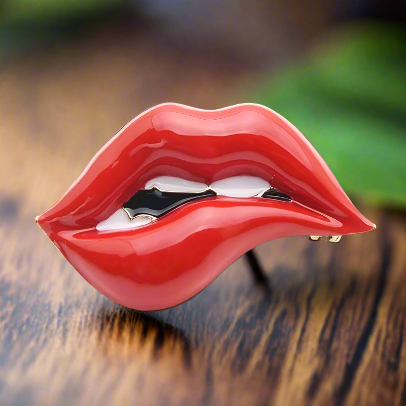 Front view of red lips lapel pin on a suit jacket for a bold fashion statement
