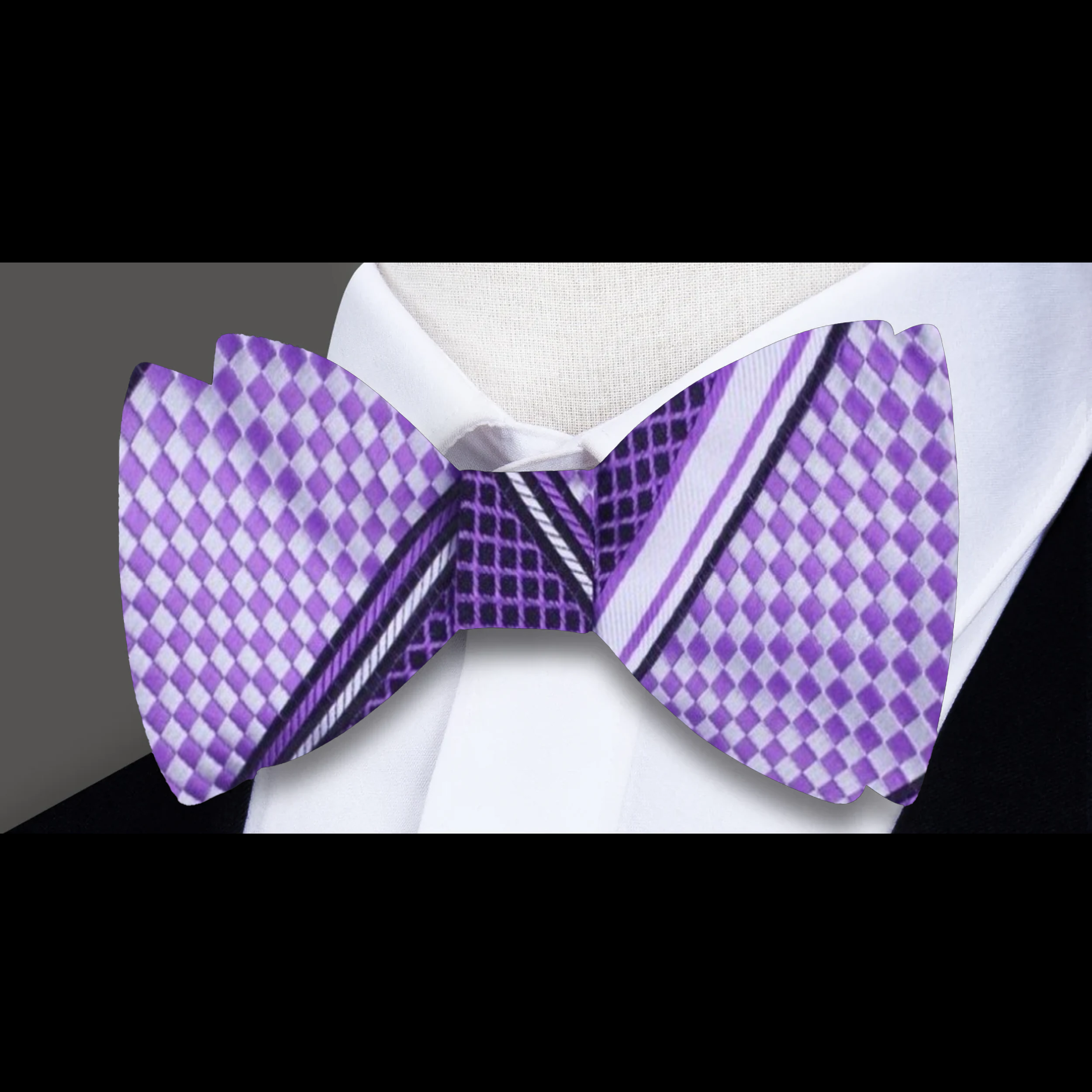 Men wearing a silk bow tie with a formal suit at a wedding