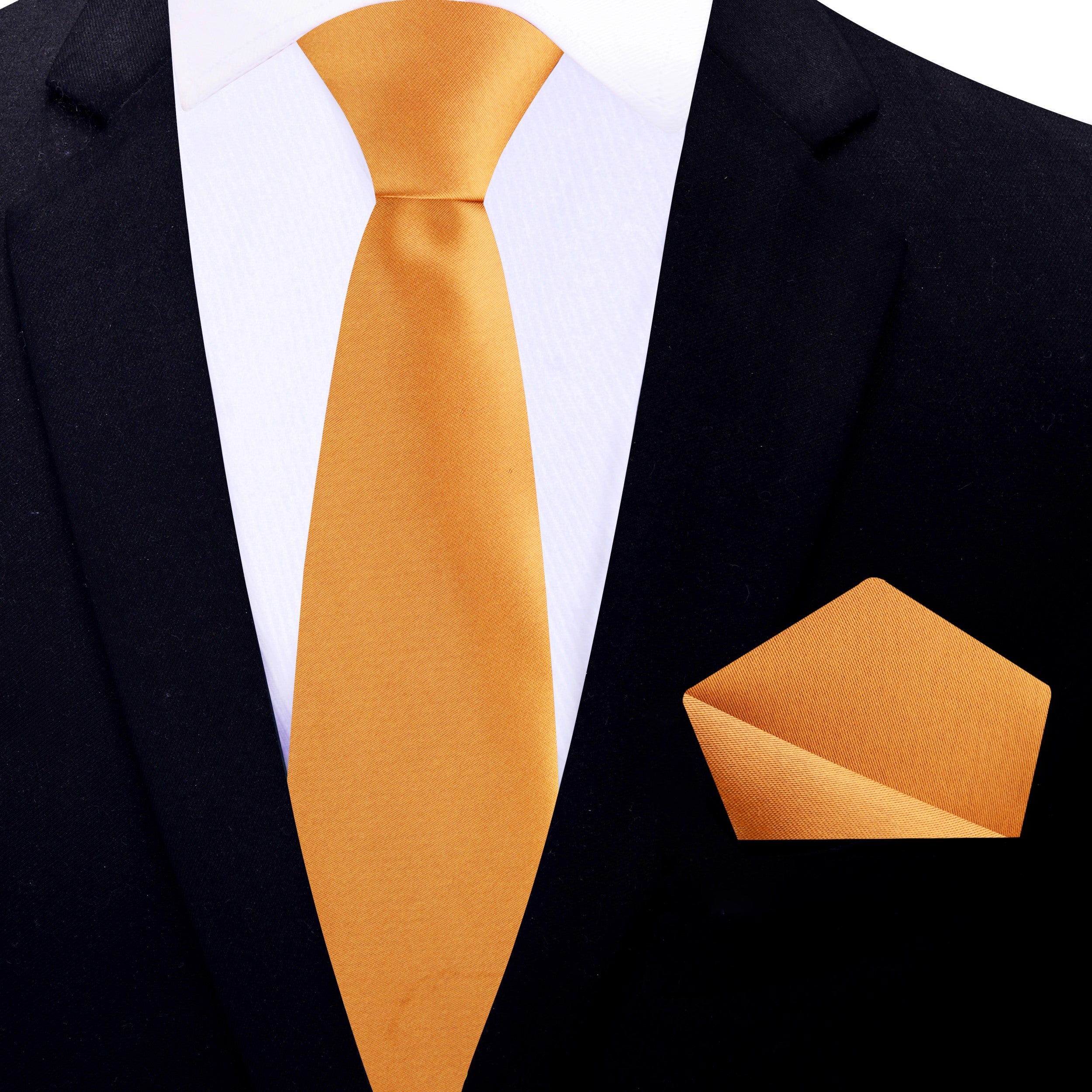 Formal mens necktie in marigold silk displayed with charcoal grey suit