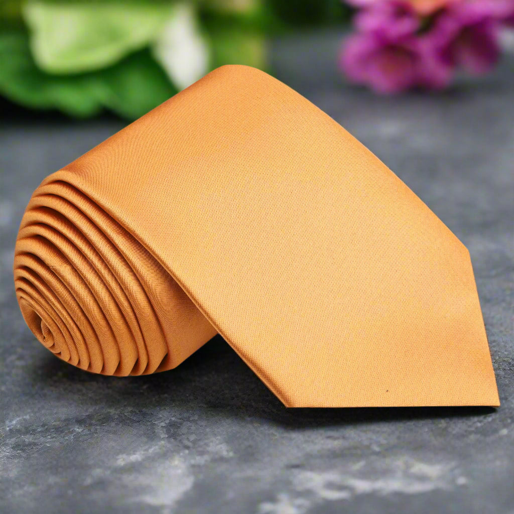 Close-up of marigold orange necktie on white shirt – ideal wedding tie