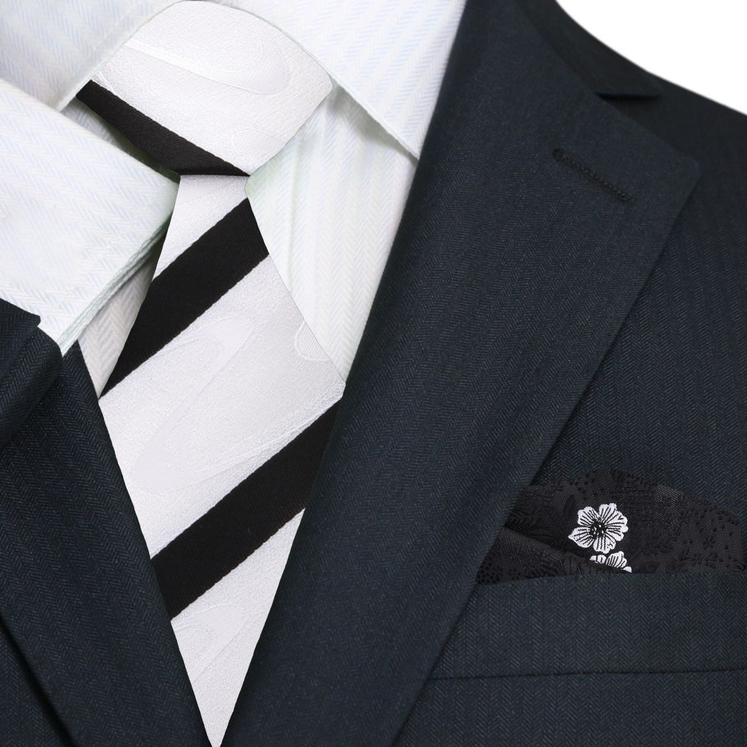 Rothmere striped silk necktie on a grey suit, highlighting the abstract wave pattern.