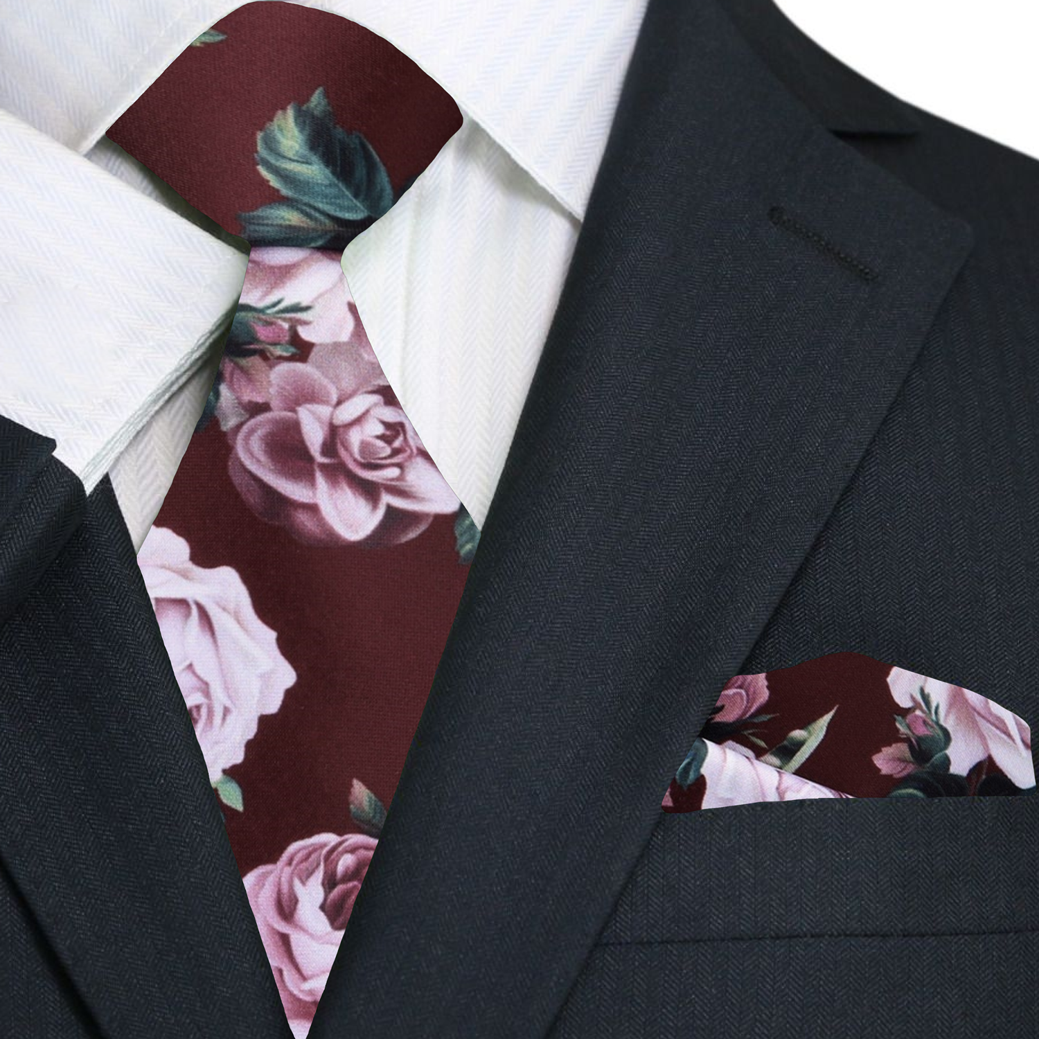 Elegant floral silk necktie displayed against a light grey suit, showcasing its intricate design of green leaves and pink roses.