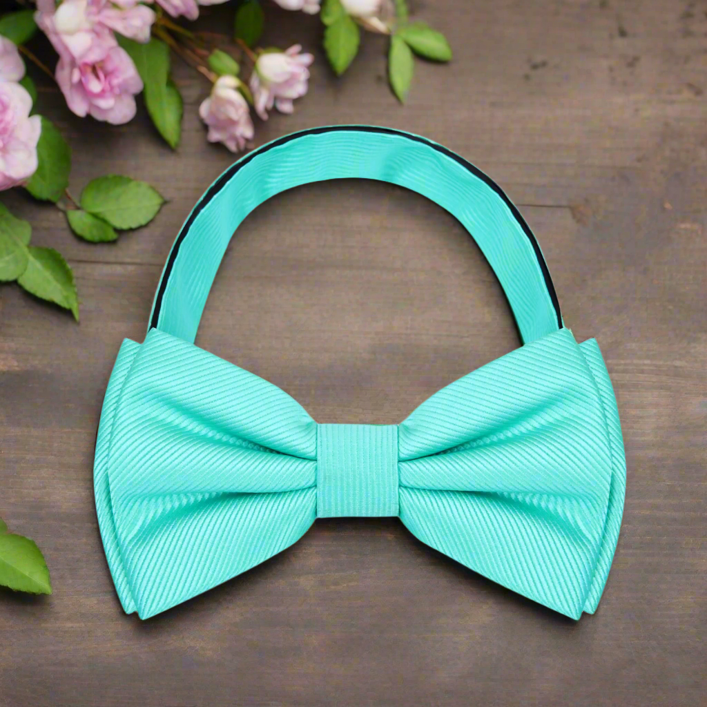 Classic solid color bow tie in royal blue, perfect for formal events.