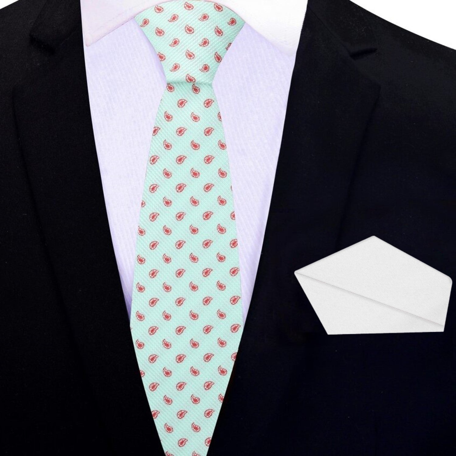 Mint green necktie styled with a navy blue suit for a sophisticated look.