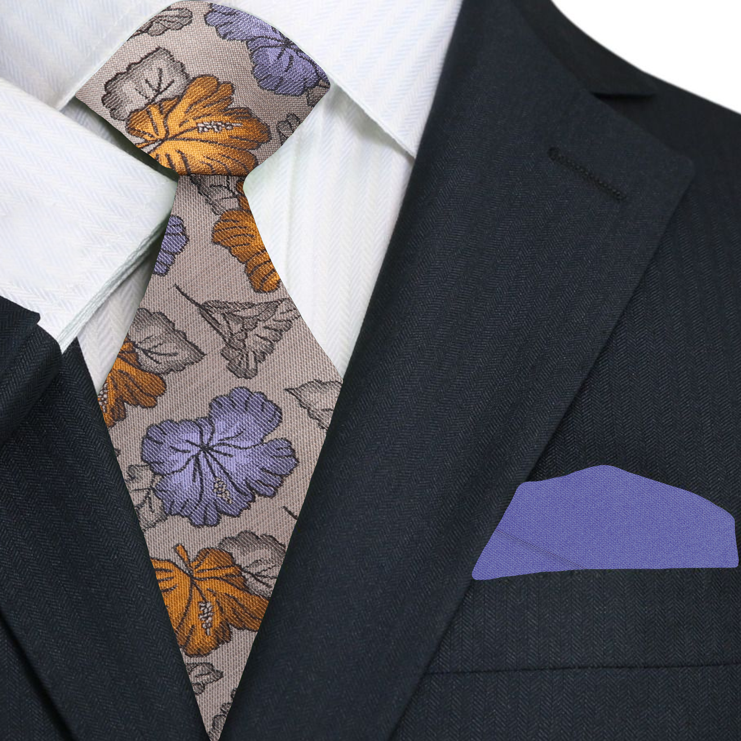 Man wearing a stylish light brown silk tie with floral pattern, suited for business or events