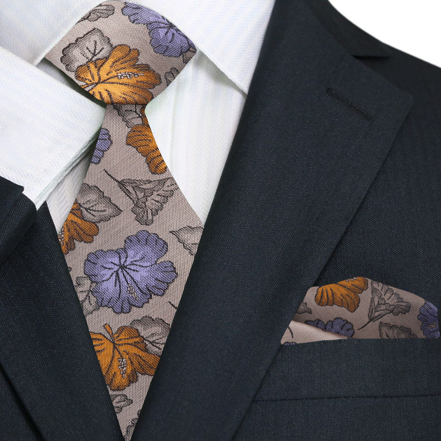Man wearing a stylish light brown silk tie with floral pattern, suited for business or events