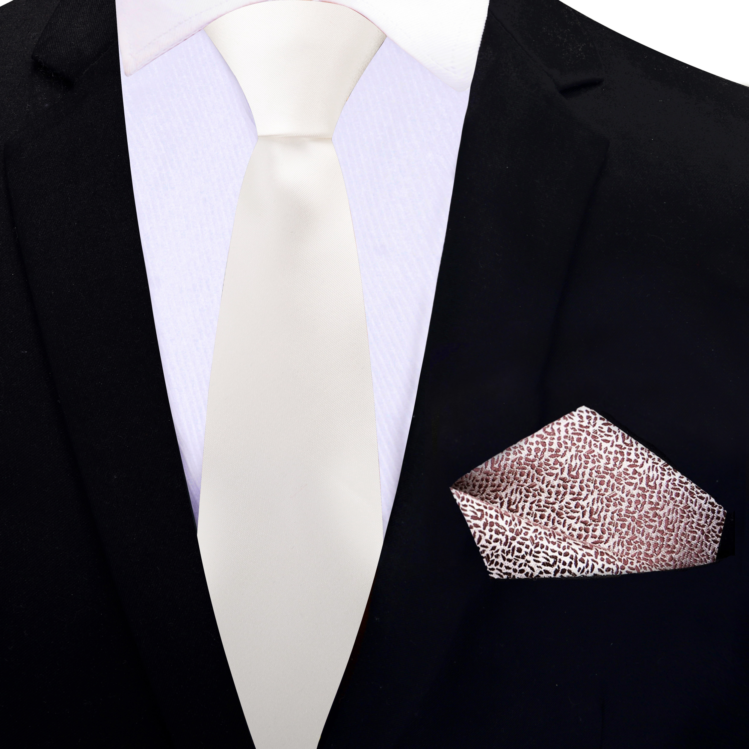 Model wearing an ivory silk necktie at a formal event, perfectly paired with a navy suit.