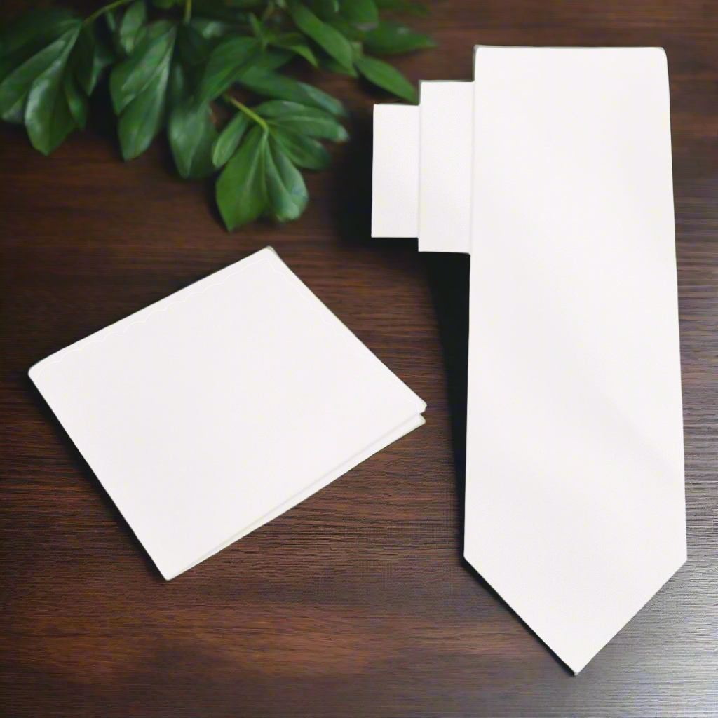 Ivory silk necktie elegantly displayed with a matching pocket square, showcasing its luxurious texture.