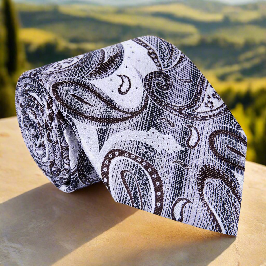 Elegant light grey and brown paisley silk tie with detailed patterns suitable for formal events.