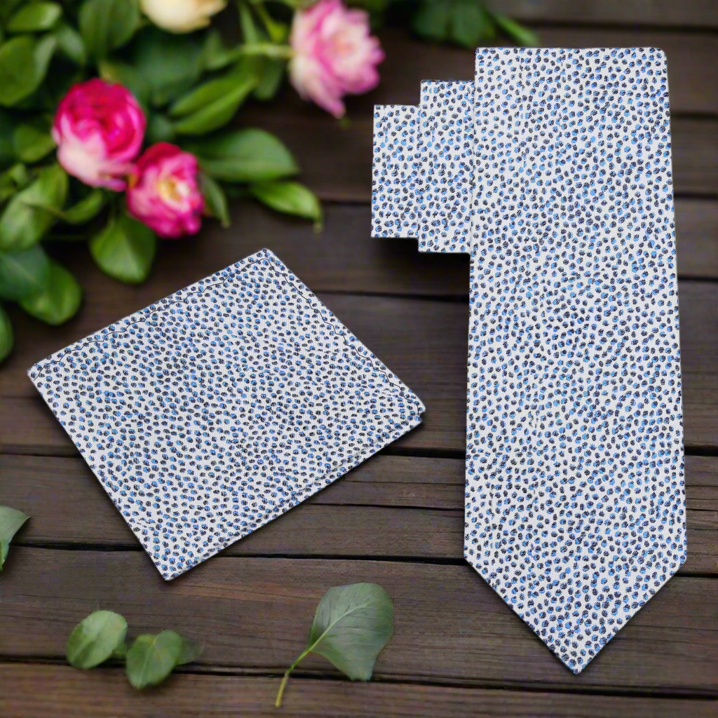 Close-up of modern silk tie with pebbles pattern in blue and black