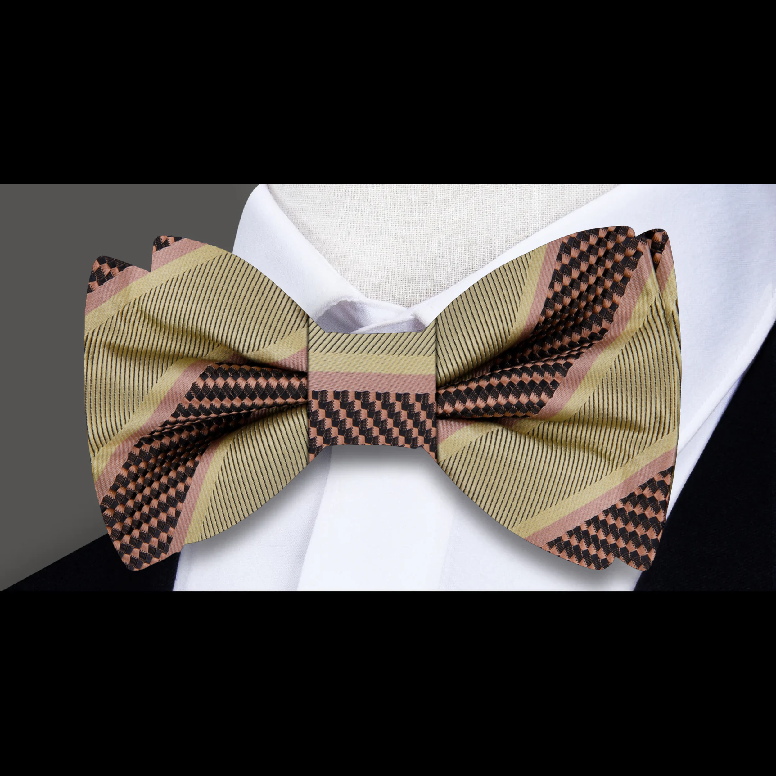 Close-up of the fabric pattern and texture of a yellow gold striped bow tie