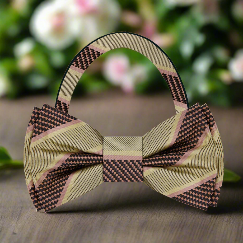 Model wearing a silk striped bow tie with a navy suit for a formal event