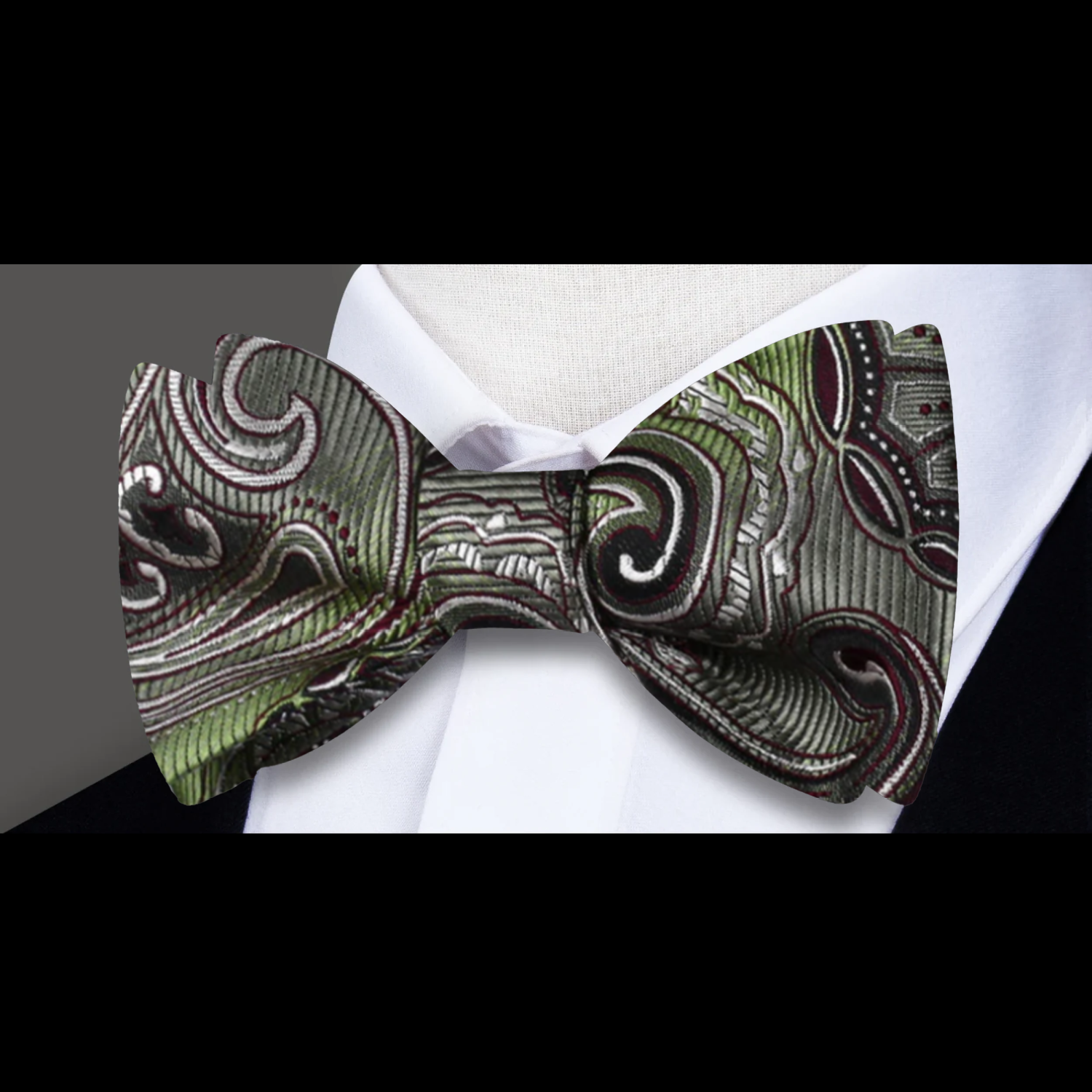 Matching paisley silk pocket square in a stylish fold for formal wear