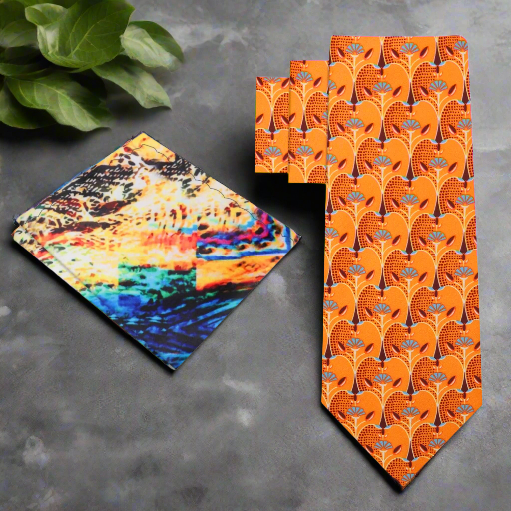 Close-up of vibrant orange silk necktie with apple slice pattern, ideal for spring occasions