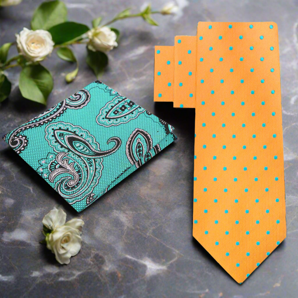 Vibrant orange polka dot necktie with aqua blue dots on a white background, ideal for weddings.