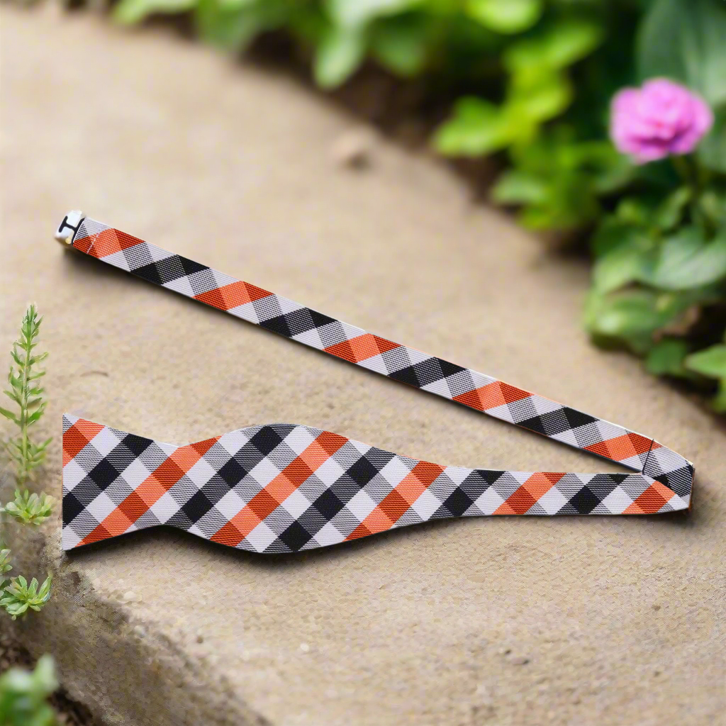 Close-up of a premium mens plaid bow tie with adjustable strap for formal attire