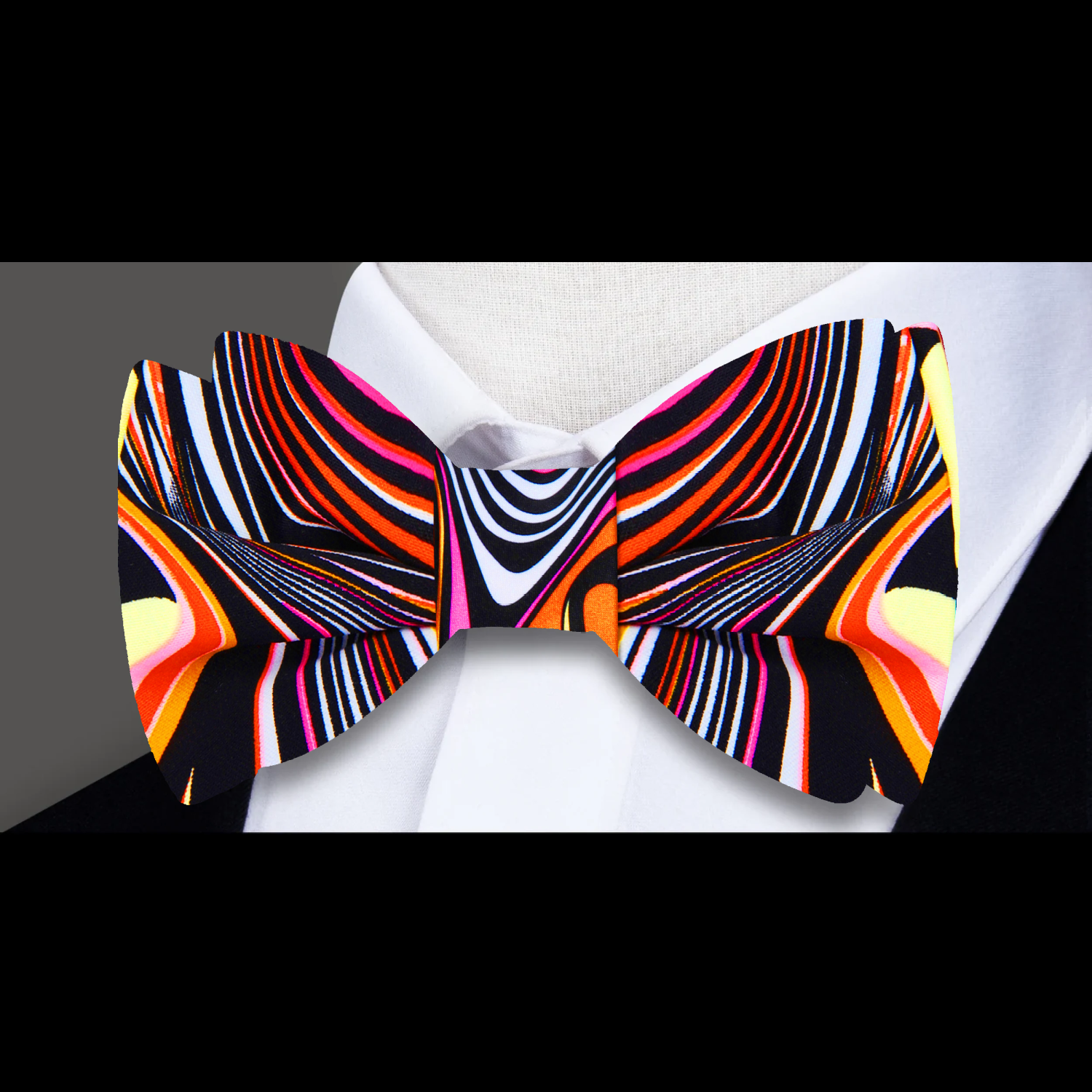 Model wearing the stylish silk bow tie at a cocktail party, highlighting its vibrant colors.