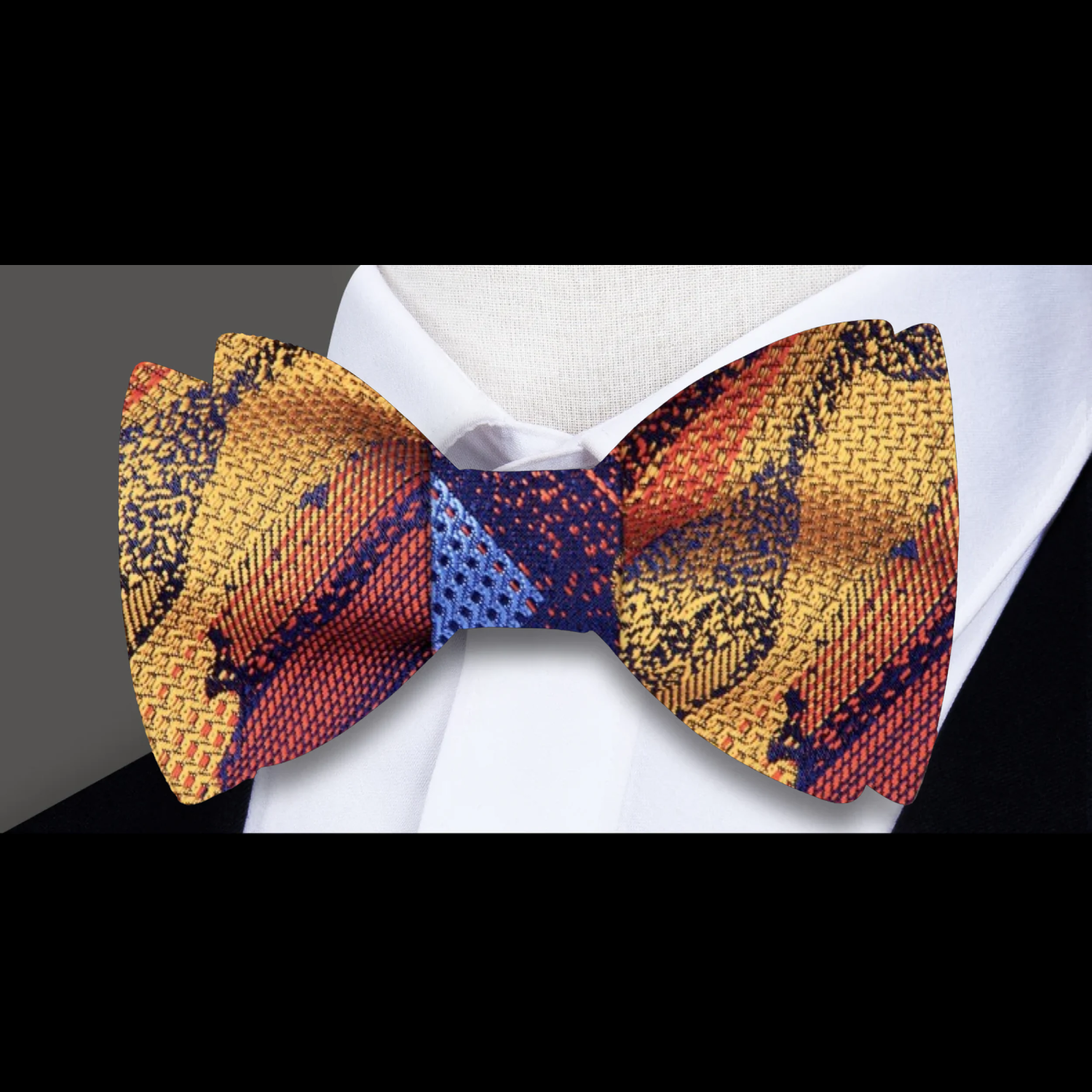 Abstract Elegance Silk Bow Tie showcasing vibrant orange, blue, and red patterns for a unique style.