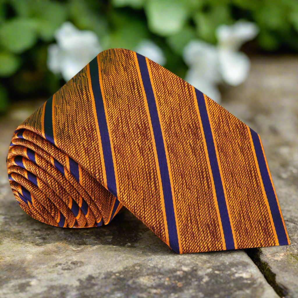 Silk striped necktie with orange, brown, and blue stripes on a white background