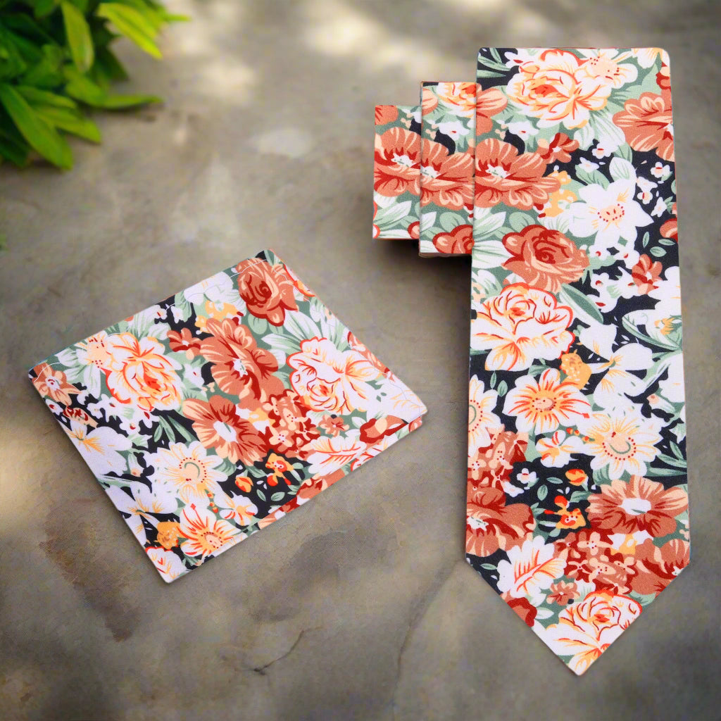 Close-up of floral silk tie with autumn colors, ideal for garden parties