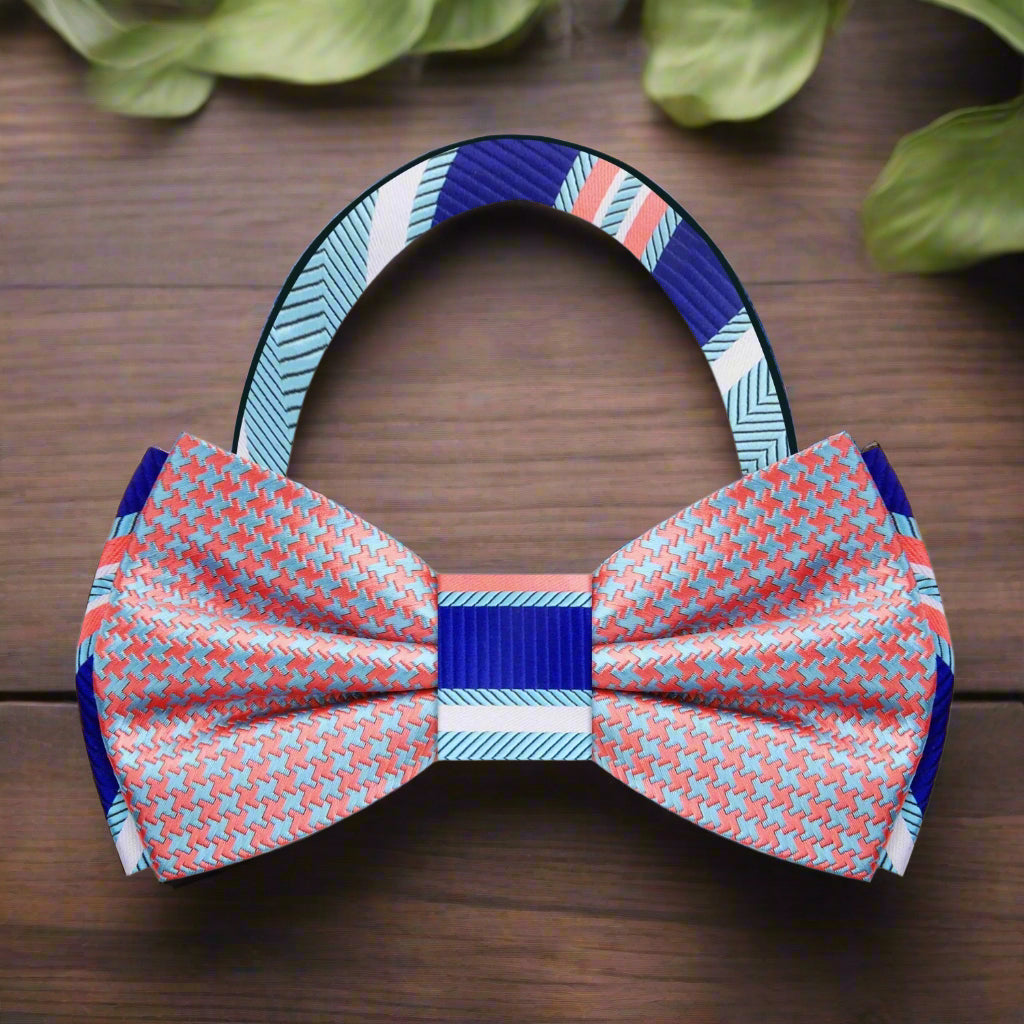 Flat lay of the bow tie and matching pocket square on a light grey suit