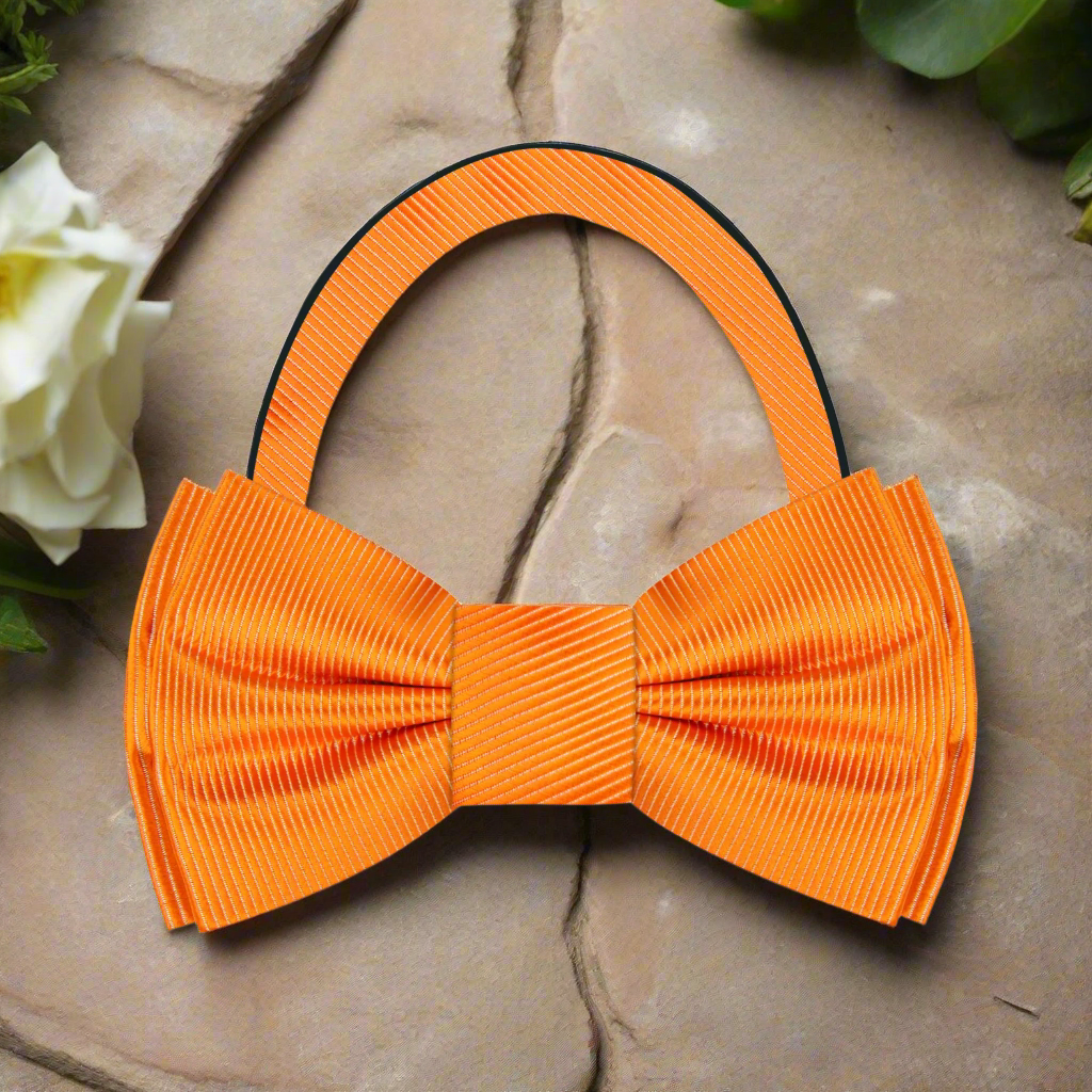 Elegant orange bow tie styled for festive celebration looks