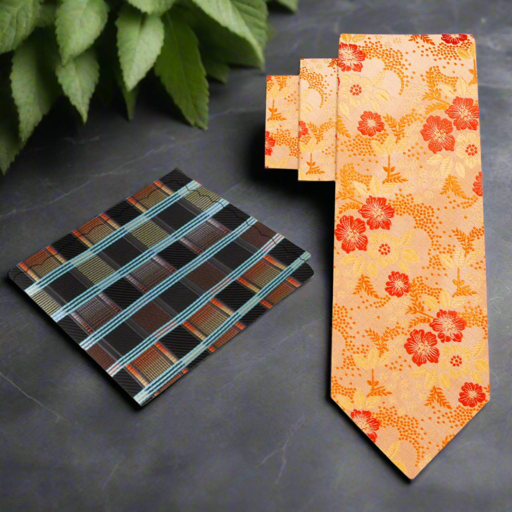 Charming orange floral necktie against a white background, showcasing intricate floral patterns.