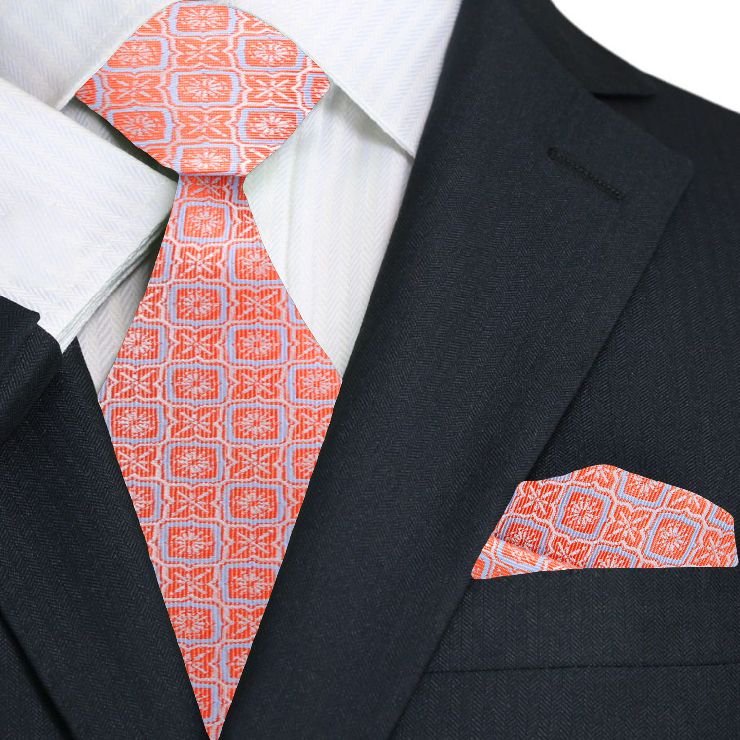 Silk necktie in peach pink with modern geometric design paired with formal suit