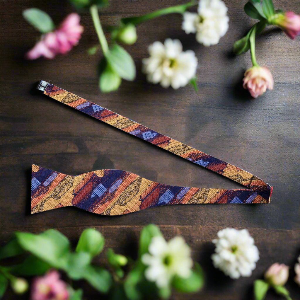 Luxury bow tie and pocket square set displayed against a formal attire background, perfect for weddings.