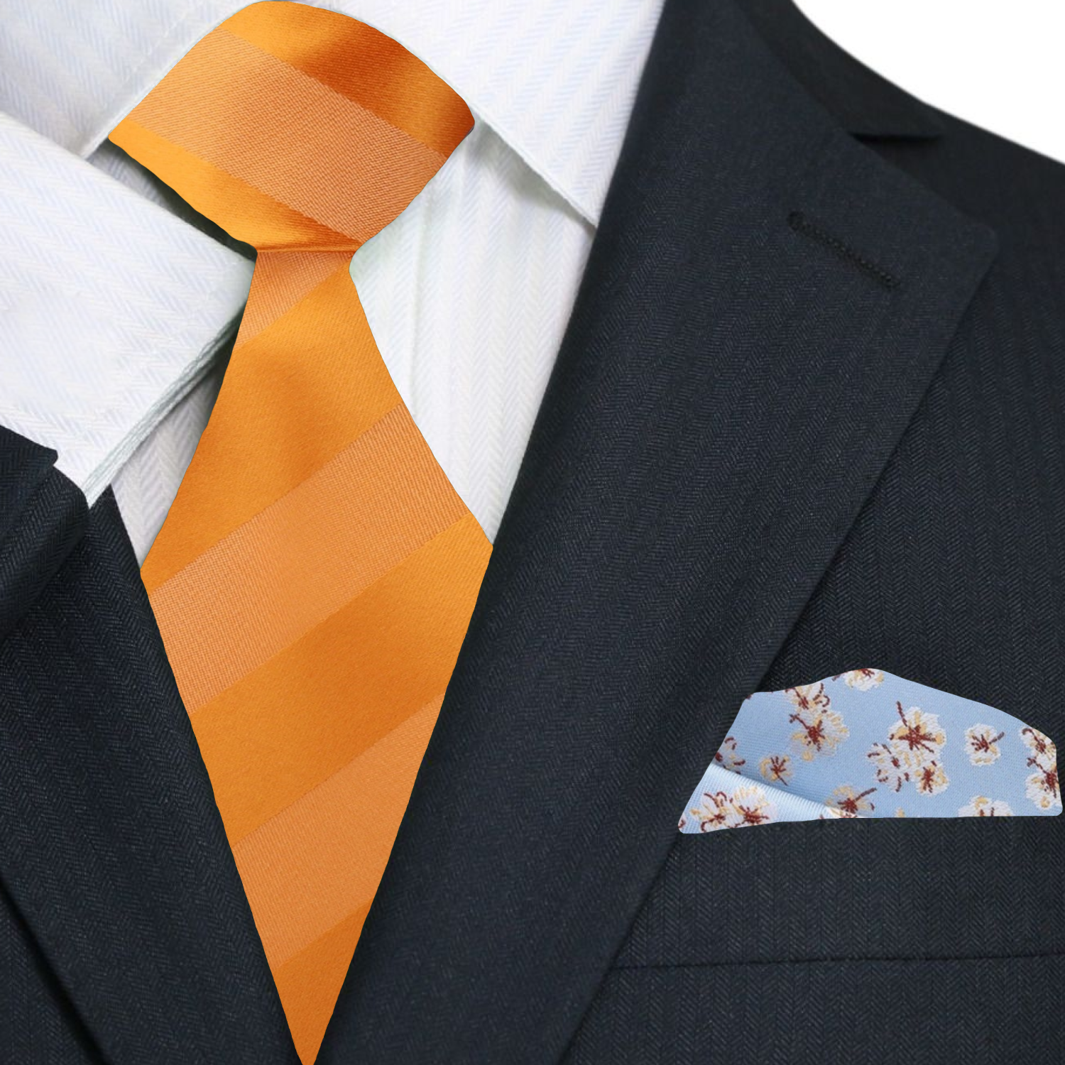 Man wearing orange silk tie with pocket square set at formal event