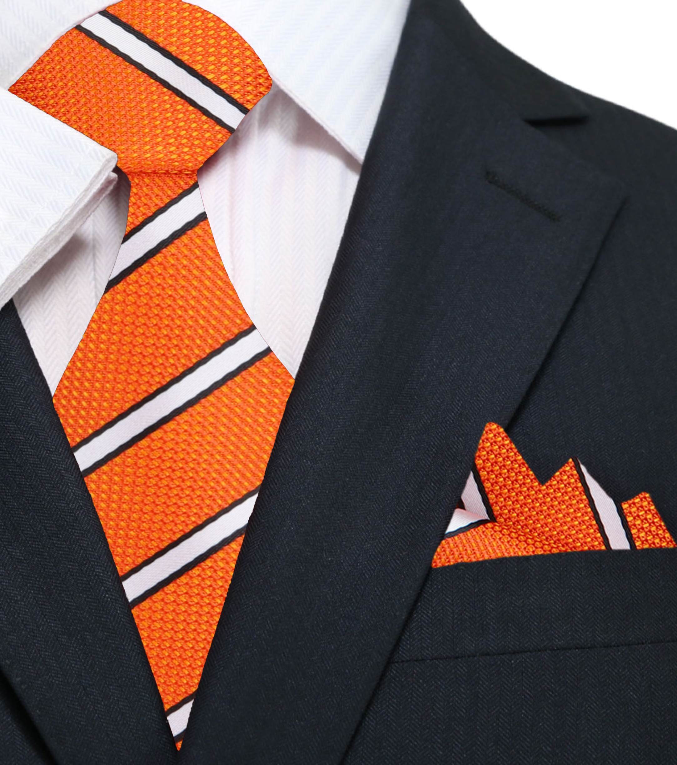 Flat lay of the silk necktie alongside matching pocket square and dress shirt