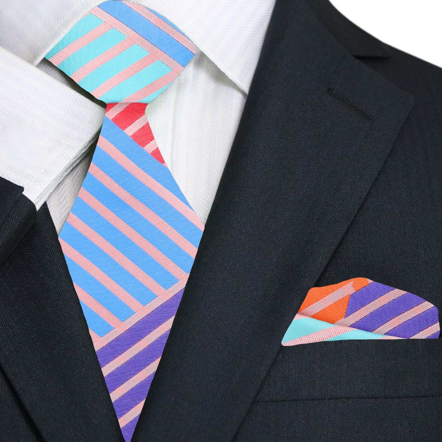 Styled image of the silk tie paired with a white dress shirt and navy suit