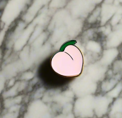 Person wearing a fun cartoon lapel pin on their jacket for a stylish accessory