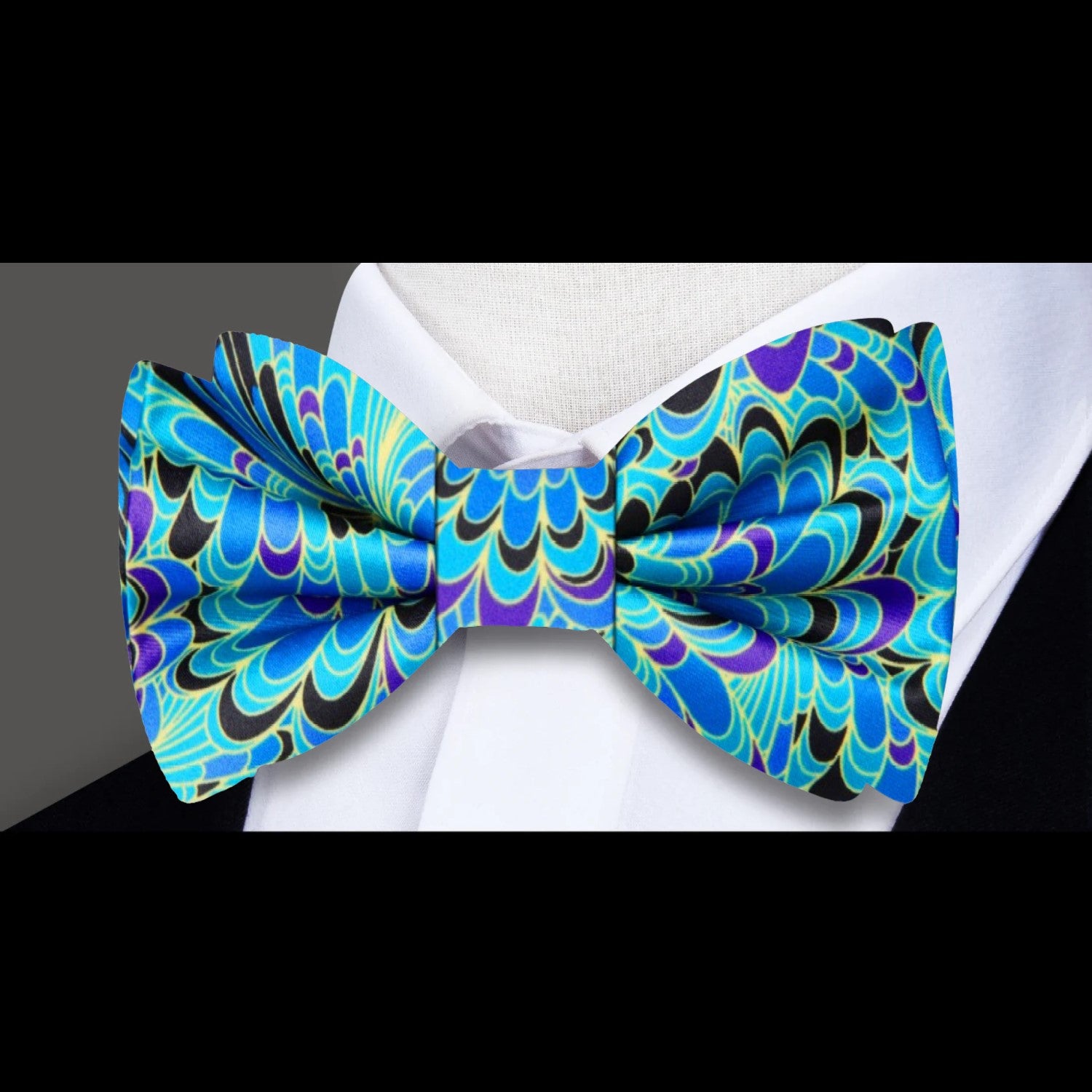 Lintonbury bow tie styled with a navy suit and white dress shirt for a formal wedding look