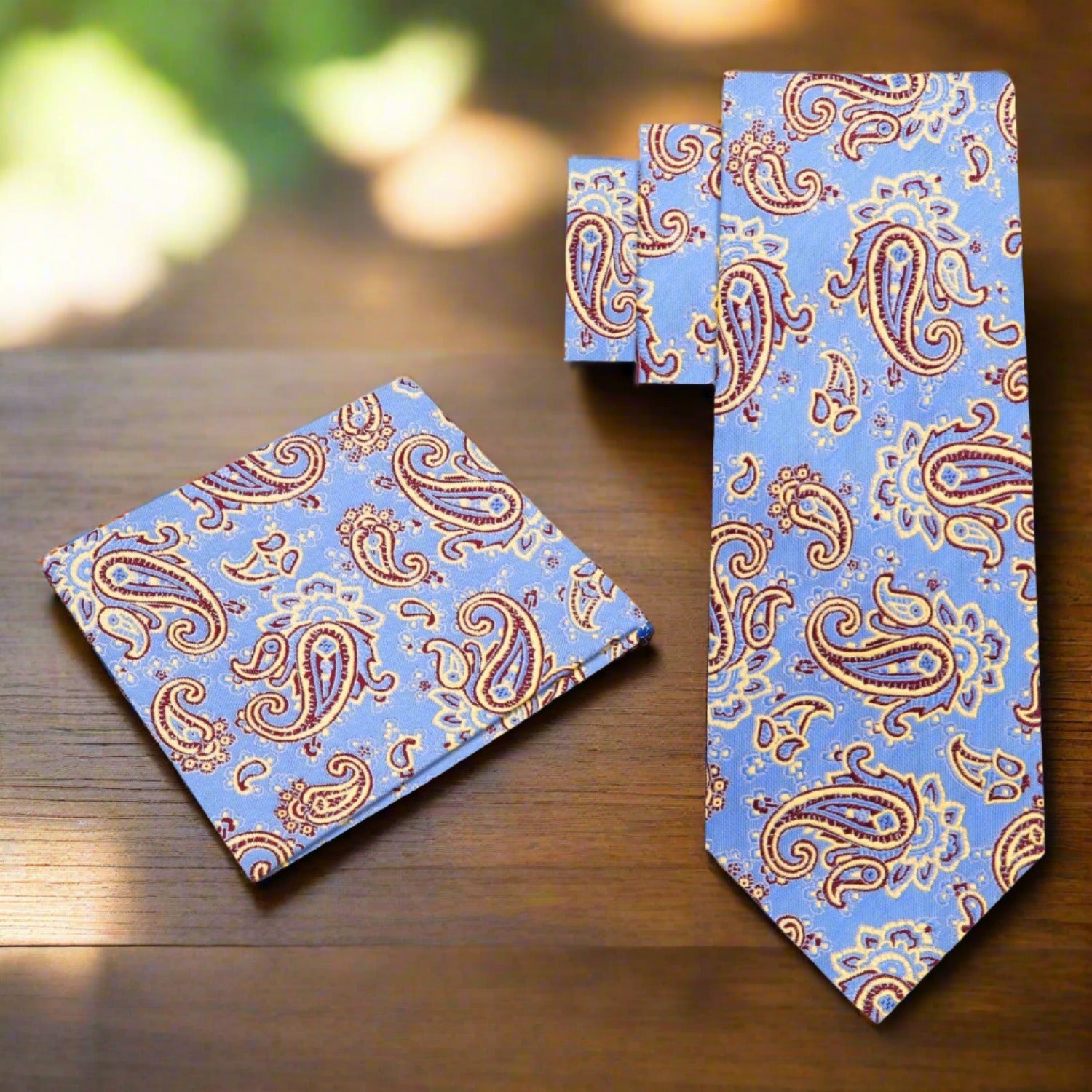 Close-up of stylish paisley silk necktie in yellow and black for formal events