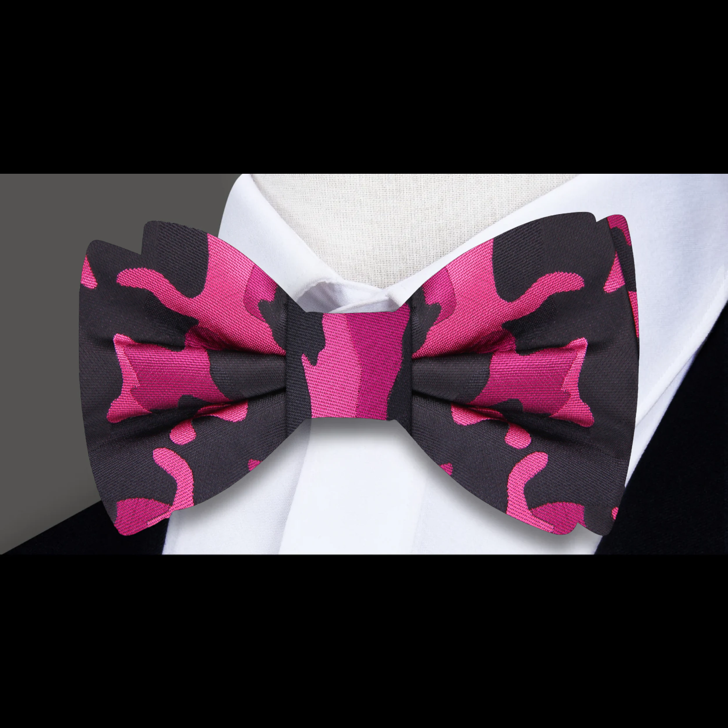 Close-up of camouflage bow tie in brown, green, and black for stylish mens accessories