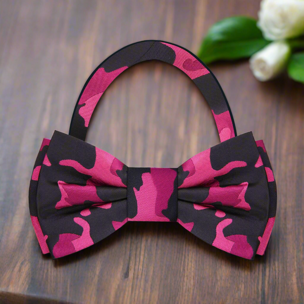 Man adjusting self-tie camouflage bow tie for a formal event