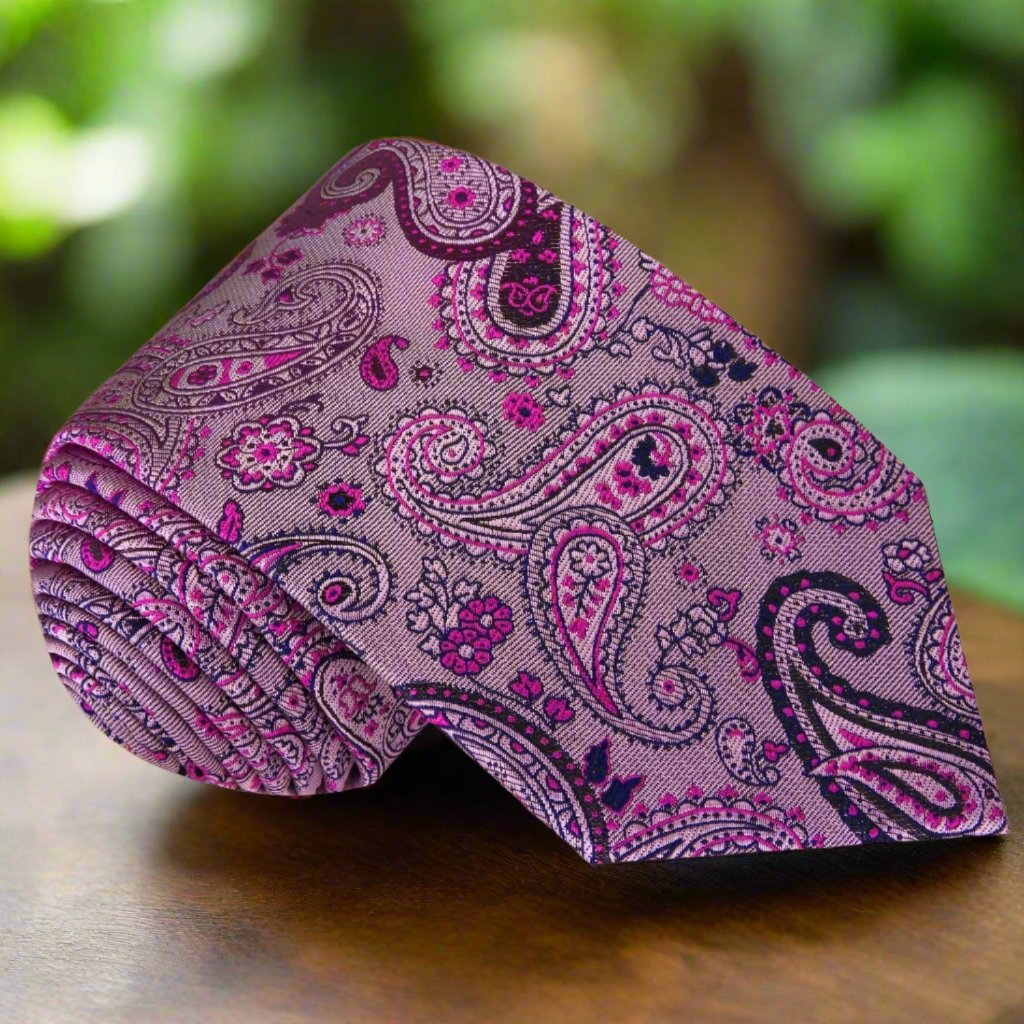 Elegant Pink and Black Paisley Necktie displayed on a white dress shirt, highlighting the vibrant design.