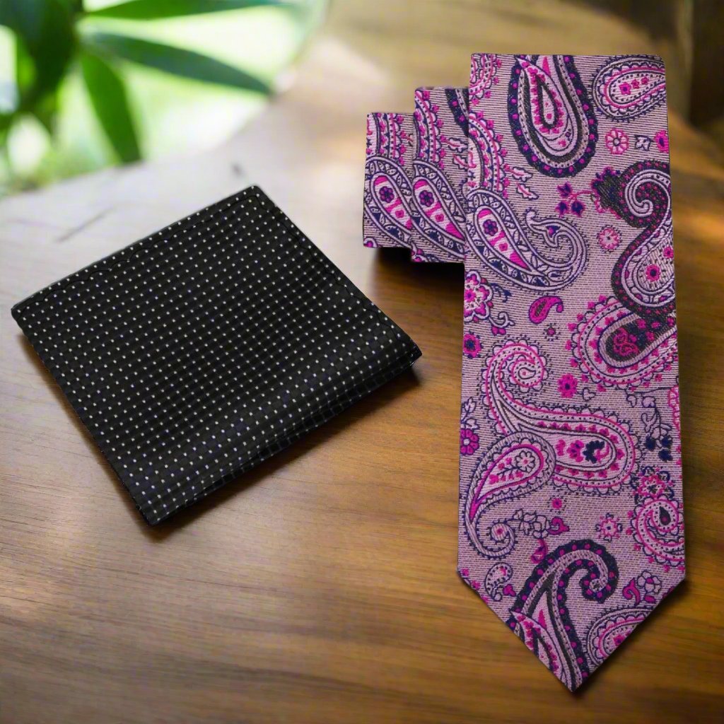 Elegant Pink and Black Paisley Necktie worn with a charcoal grey suit, demonstrating a stylish business look.