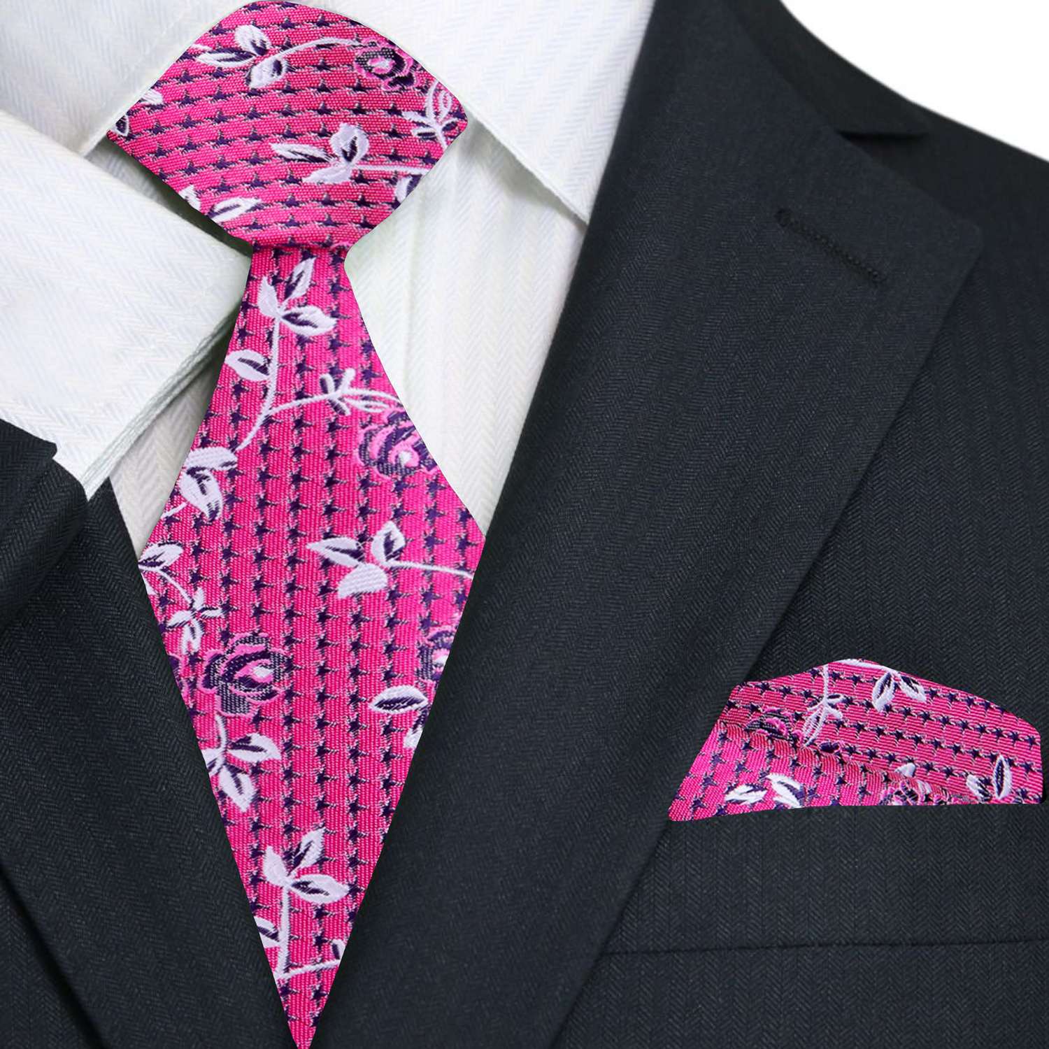 Man wearing a floral pattern tie with a suit at an outdoor garden party