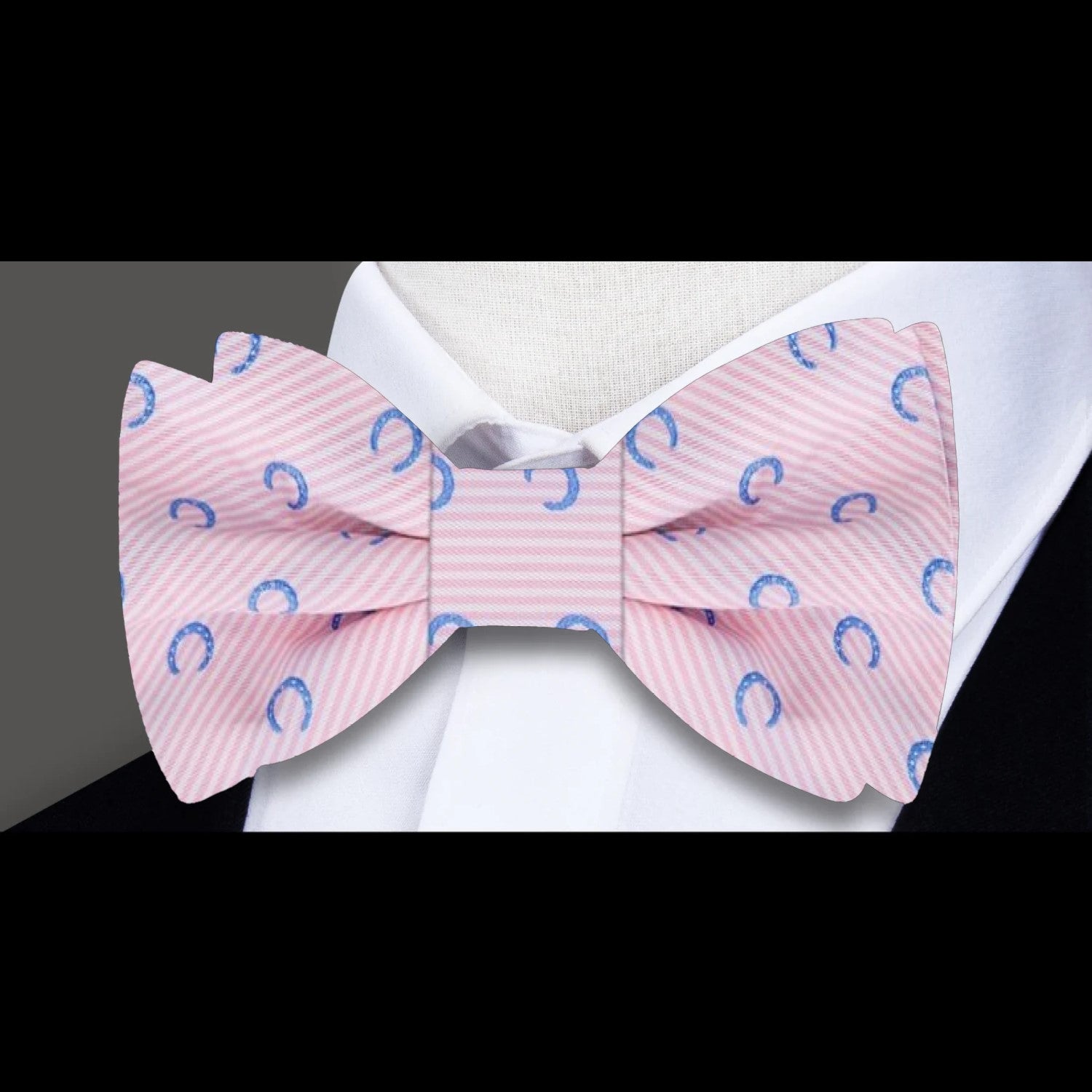 Pre-tied silk bow tie showcasing a whimsical horseshoe design for formal events.