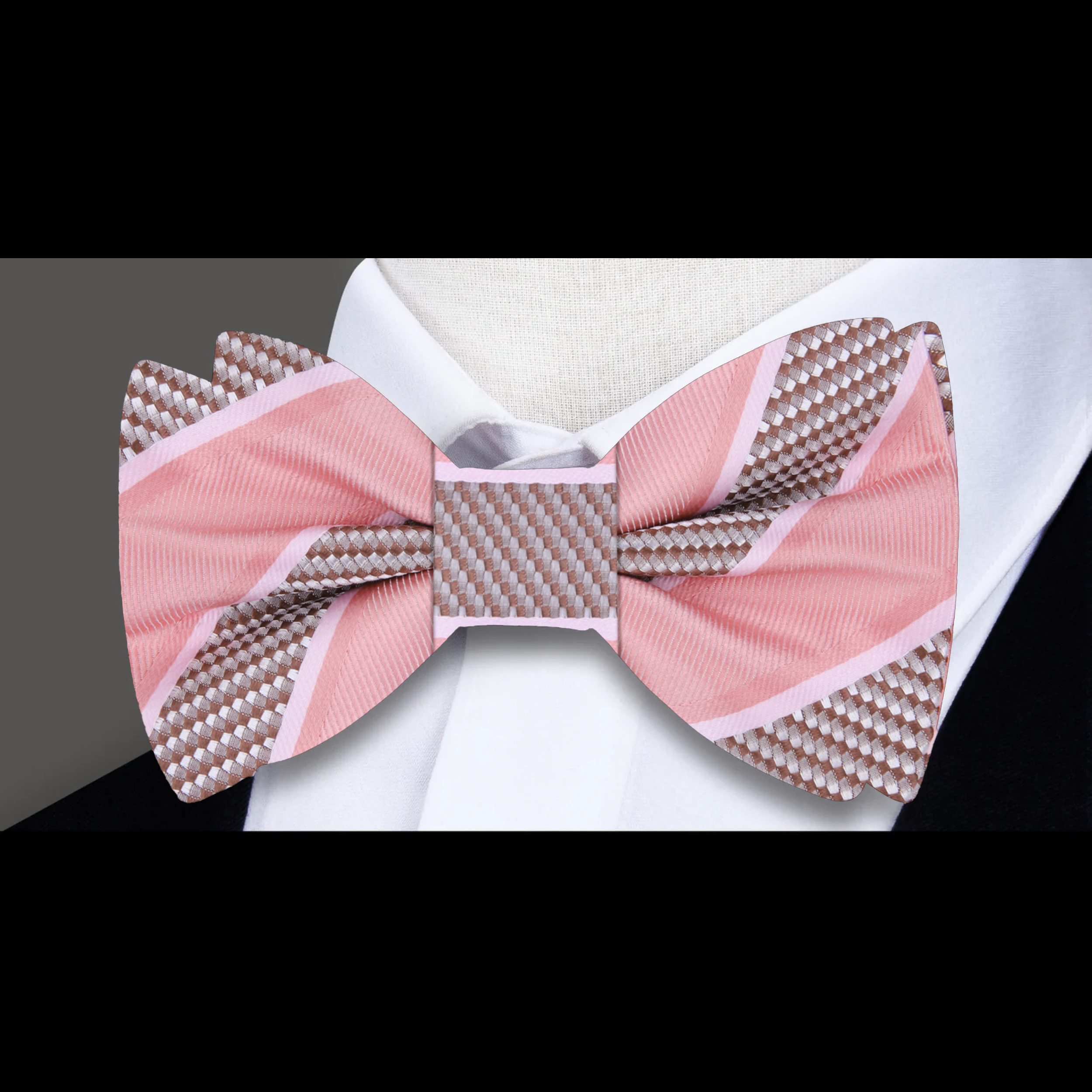 Close-up of the fabric pattern and texture of a yellow gold striped bow tie